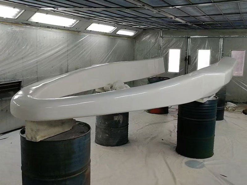 Shaped solid foam boat collar section with finished outer coating during production.