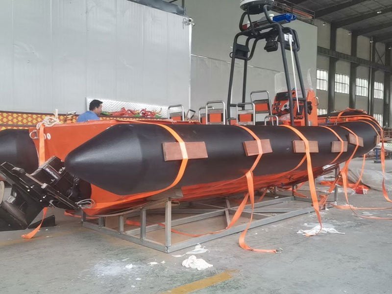 Solid foam boat collar with SPUA outer skin fitted along the hull of a workboat.
