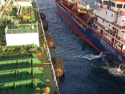 Fenders being used in ship-to-ship transfer at sea