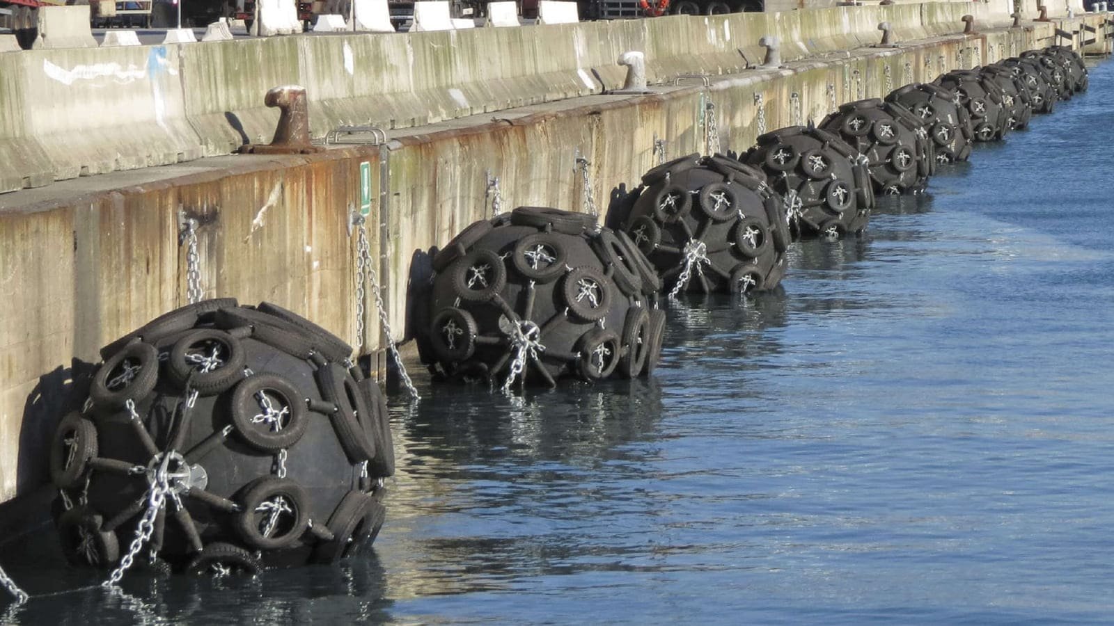 Large container ship safely berthed with Yokohama-type fenders