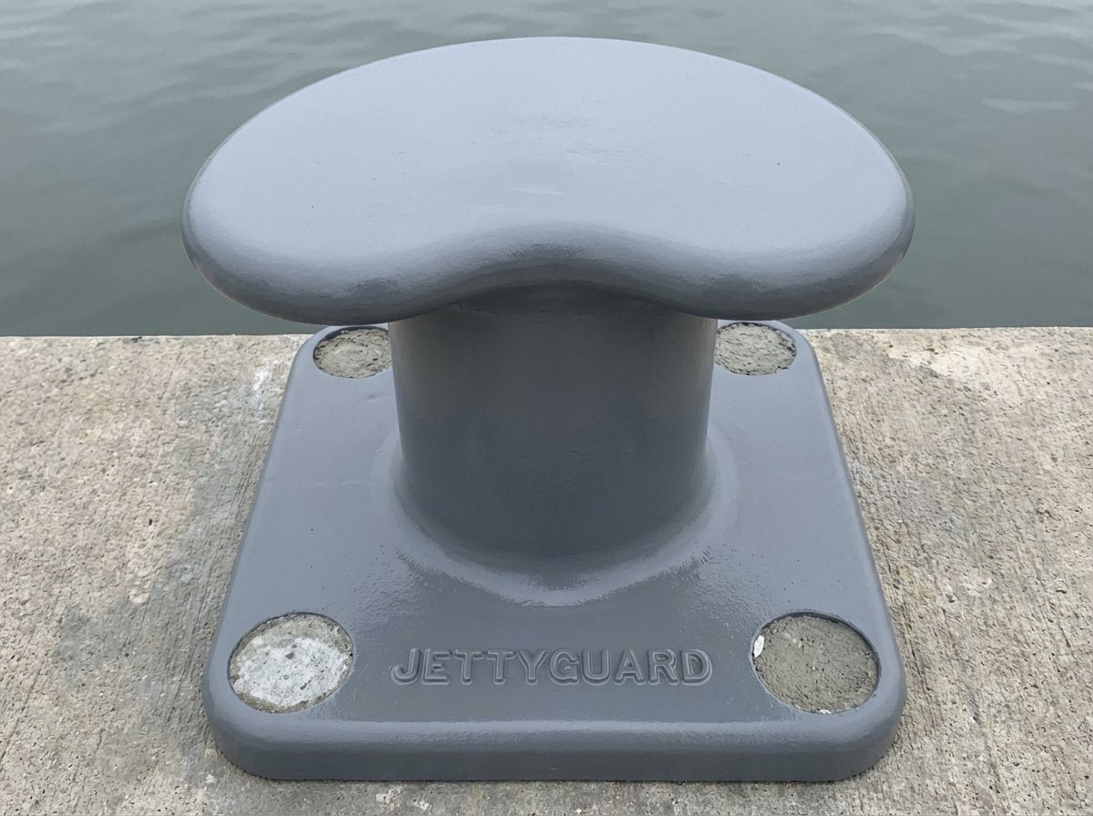 Kidney shaped bollard on a harbor with calm water