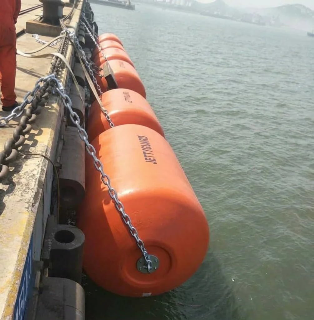 Foam filled fenders protecting commercial port dock