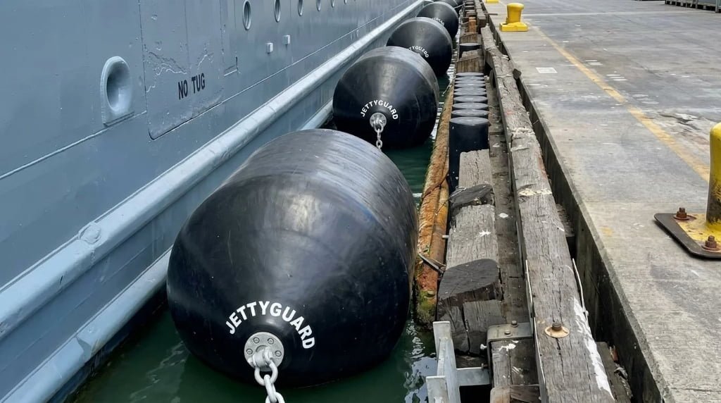 Foam filled fender compressing under vessel contact