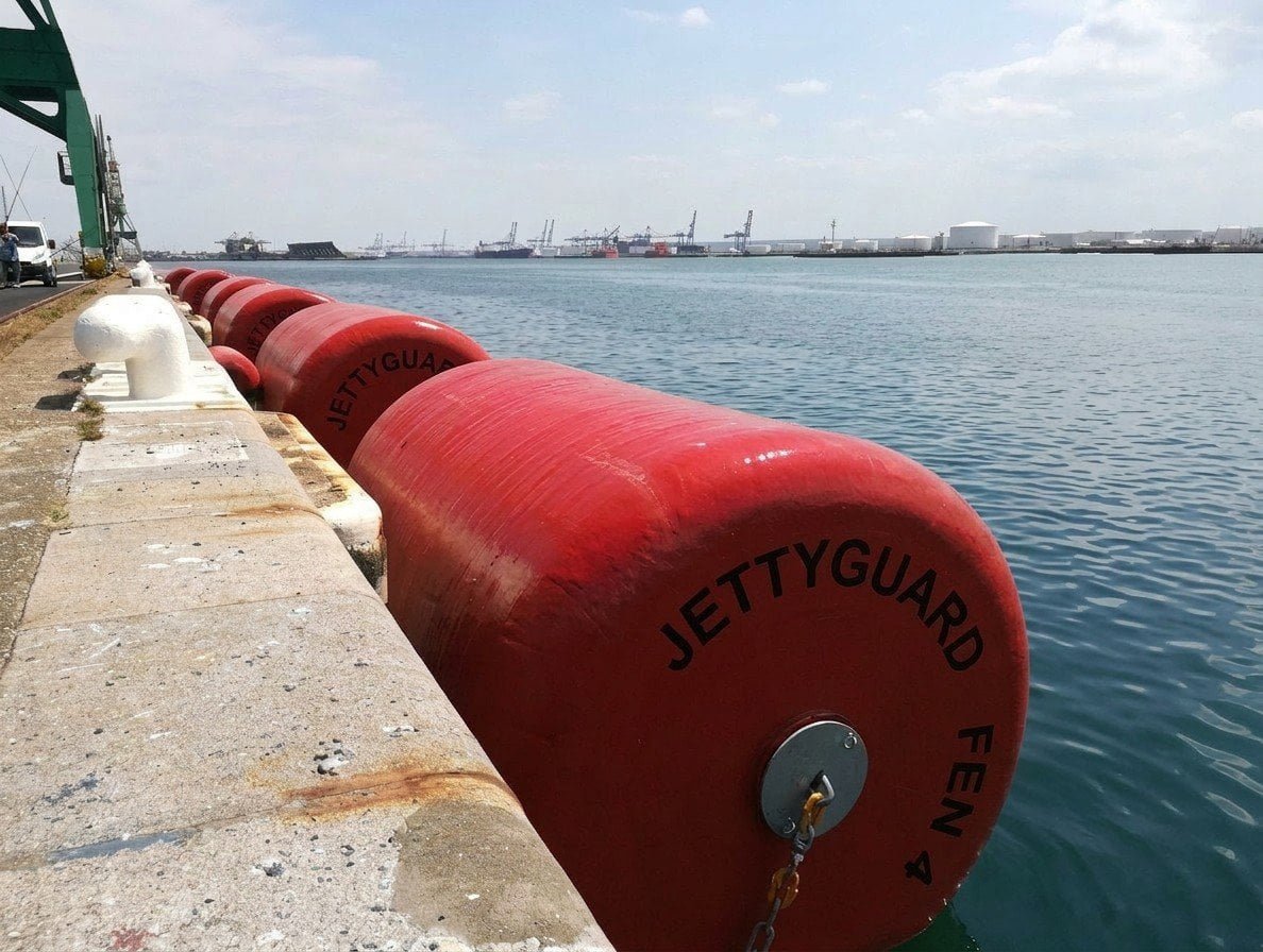Quay wall protected by foam filled fender system