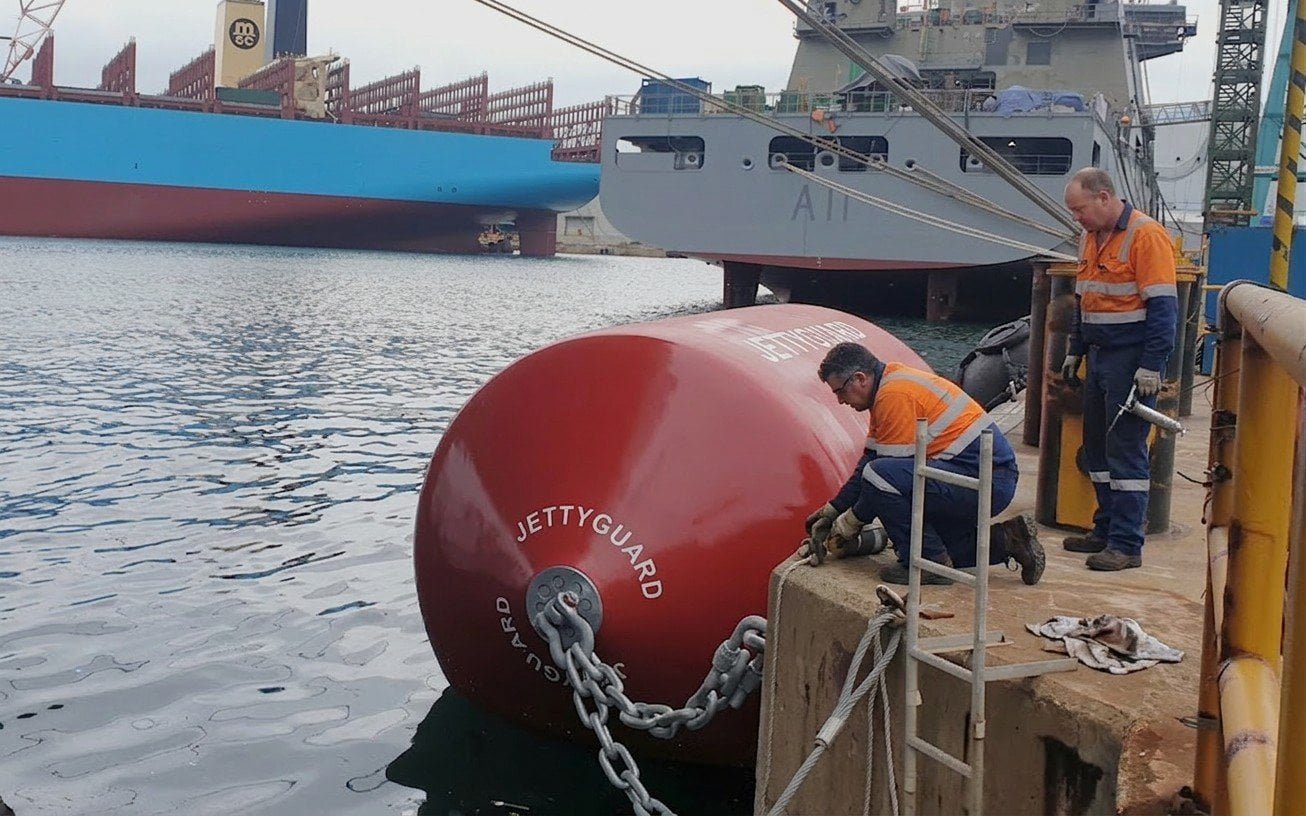 Port maintenance team inspecting foam filled fender