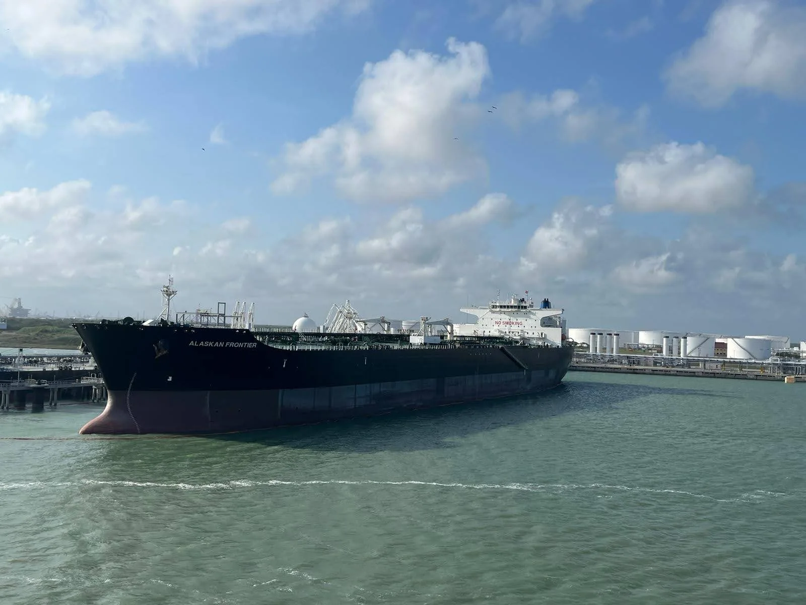 Oil vessel alongside a marine terminal jetty