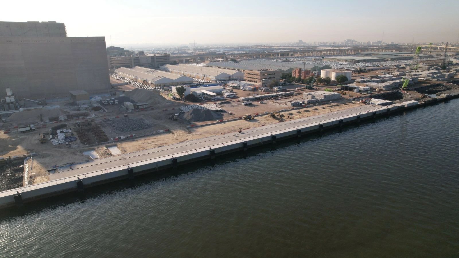 New quay under construction with installed molded rubber fender systems along the berth edge