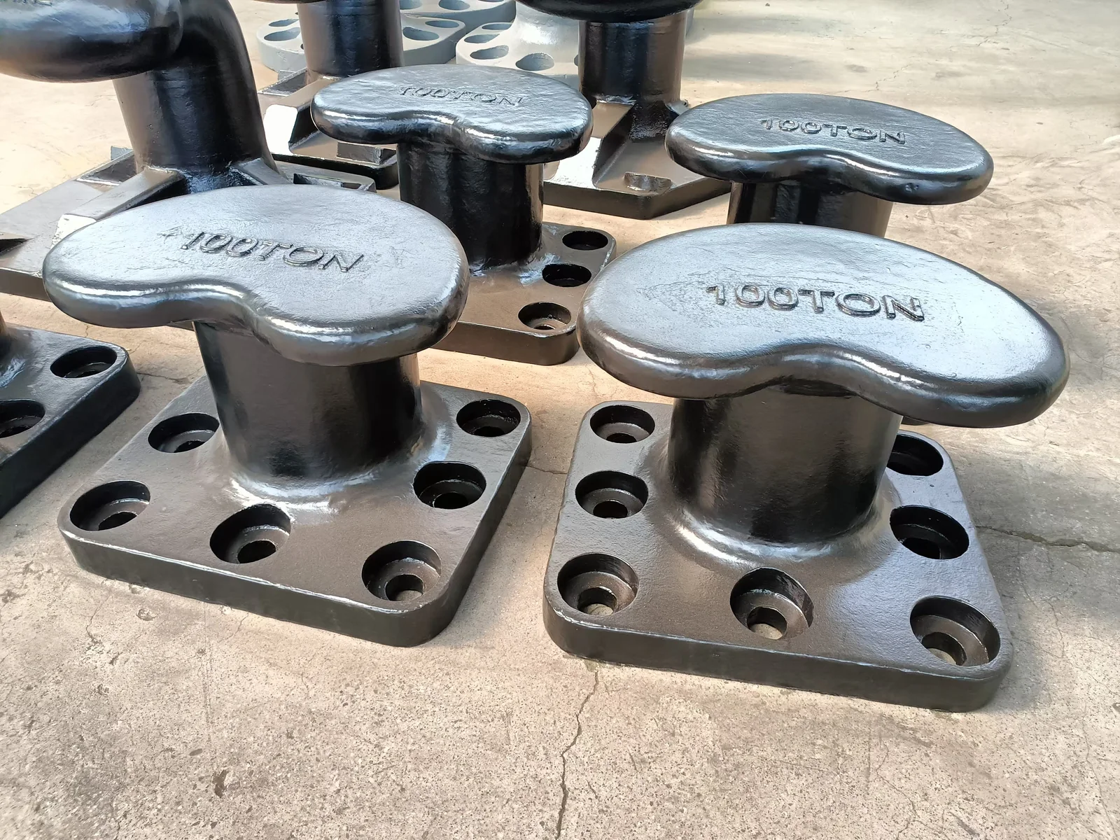 Black coated kidney mooring bollard at the workshop