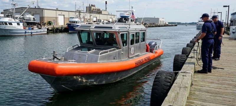 Solid foam boat collar attached to a workboat hull